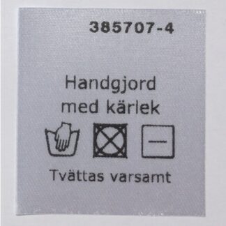 Lapp med tvättanvisning "Handgjord med kärlek"